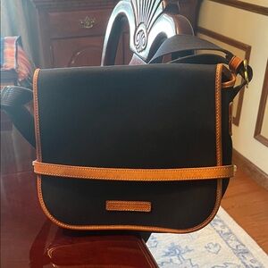 Dooney and Bourke Women’s navy Crossbody Bag with Tan Trim. 3 spots inside trim